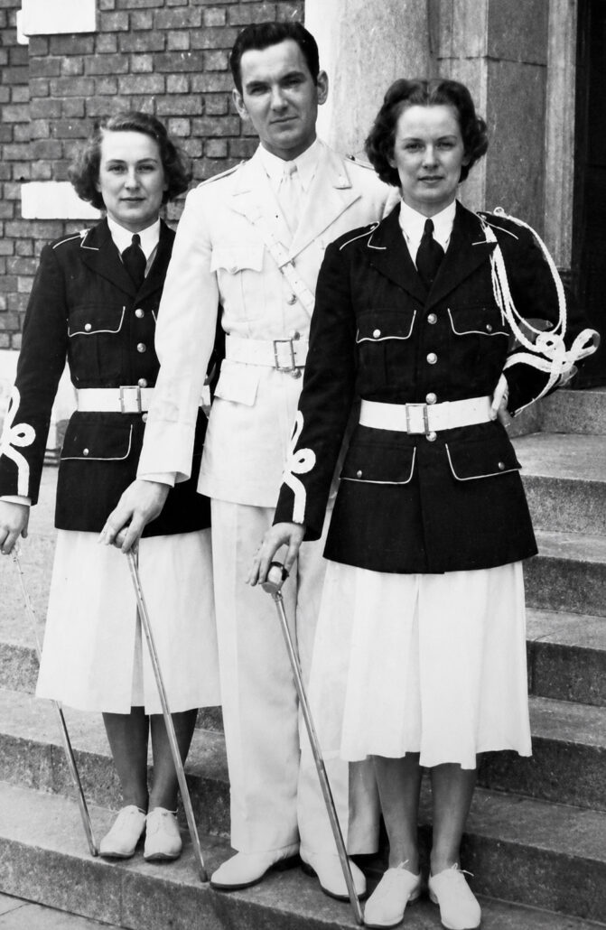 Drum majors Alberta Johnson, Stan Bozek, and Erma Alvord. Johnson and Alvord were the first women to join the college band.