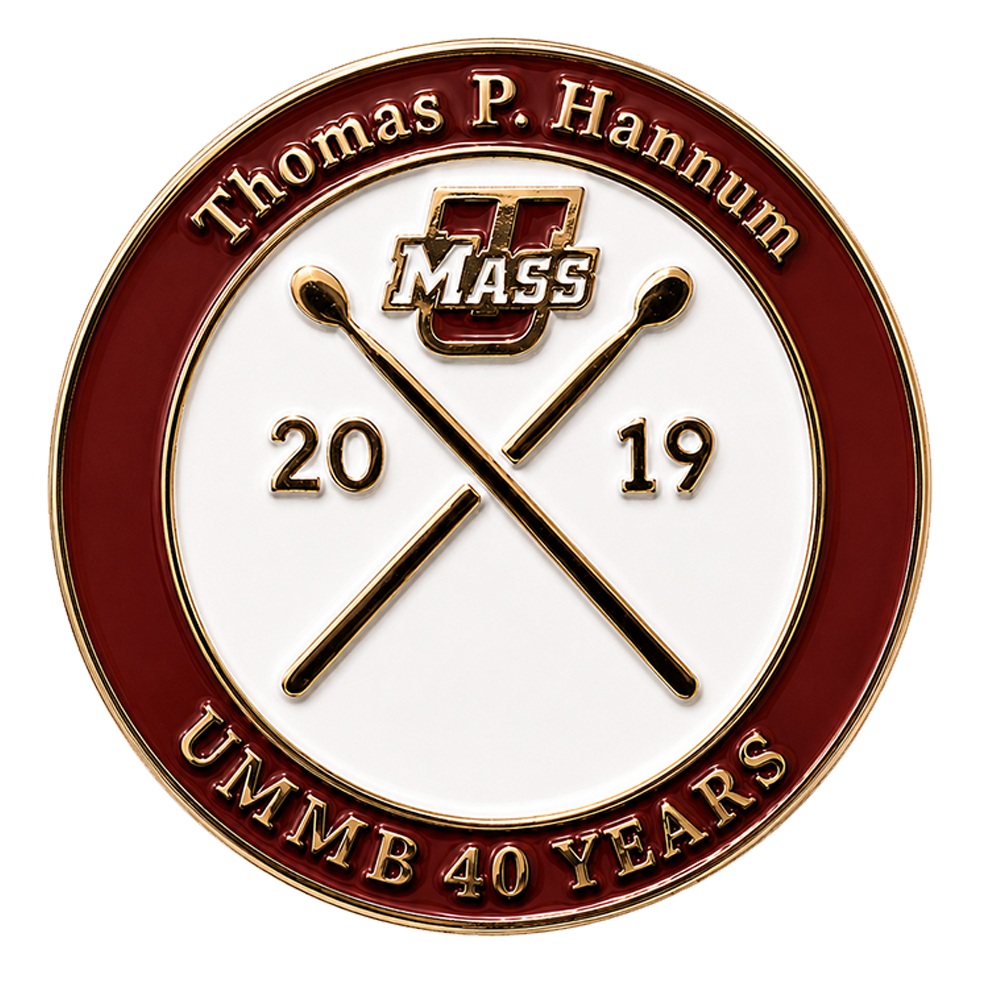 The 2017 pin features the 51st Alumni Band by name